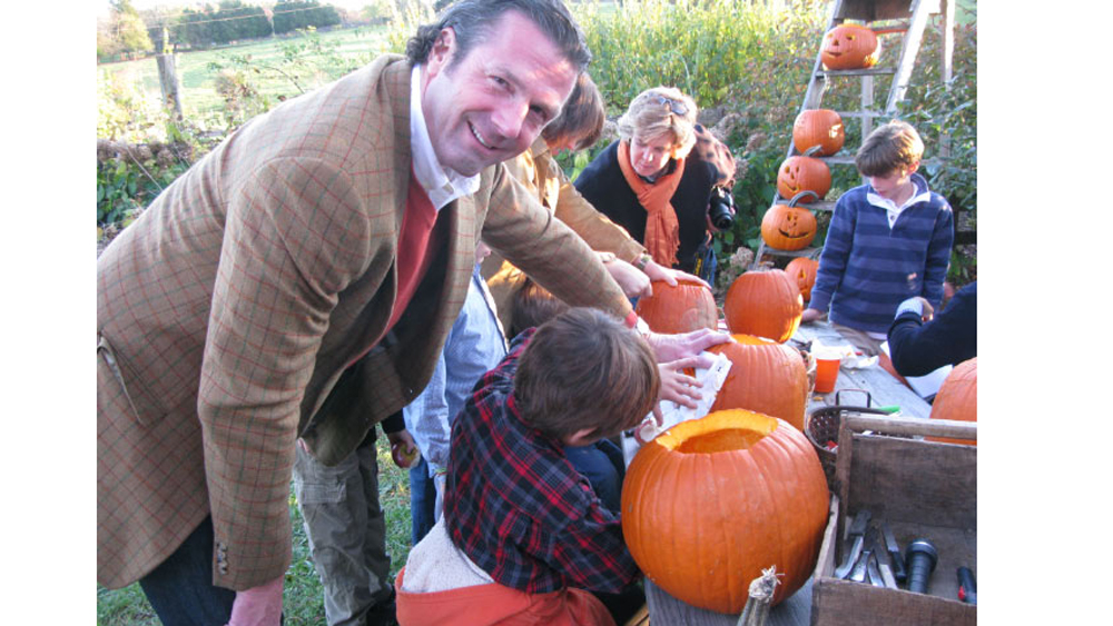 Tim helps his nephew with carving