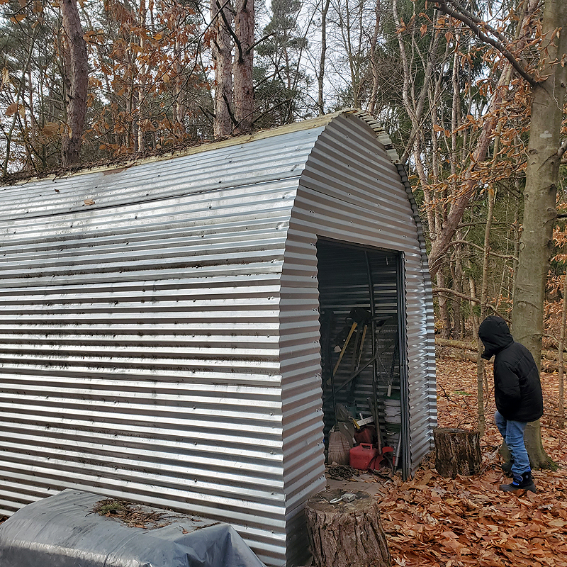 Henry inspects the gator shed at The Woods