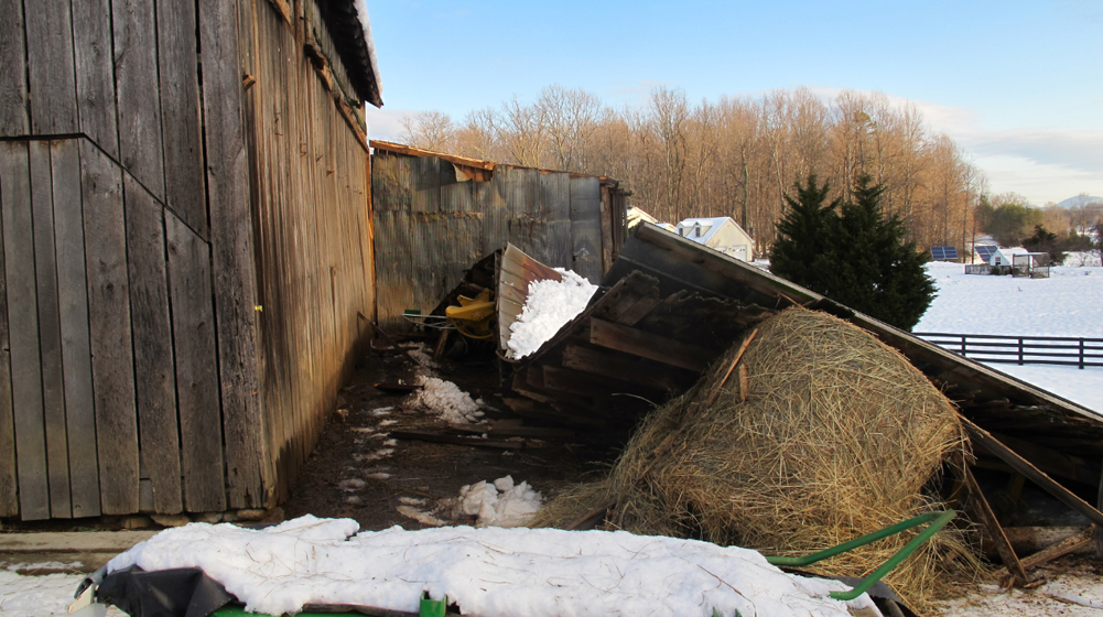 Shed roof collapses in wind and snow