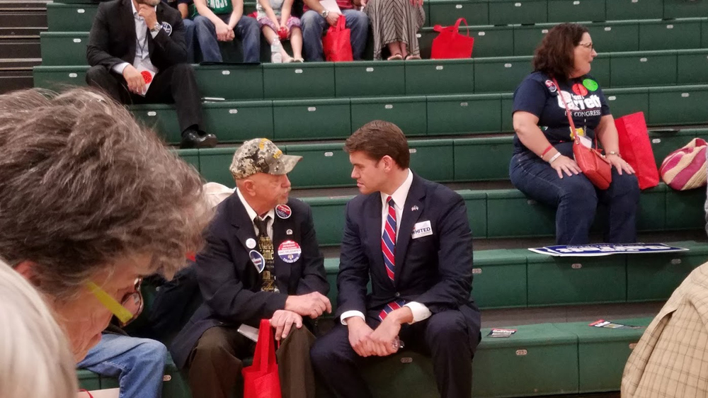 The Candidate listens to a veteran