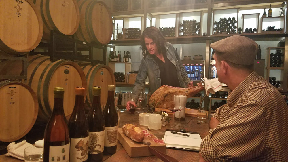 Maggie tempts Keith with wine, ham, and music